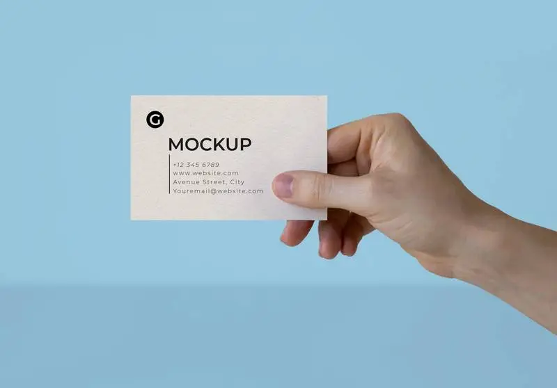 A Hand Holding a Business Card Mockup