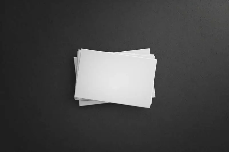 White Business Cards Isolated on Dark Background