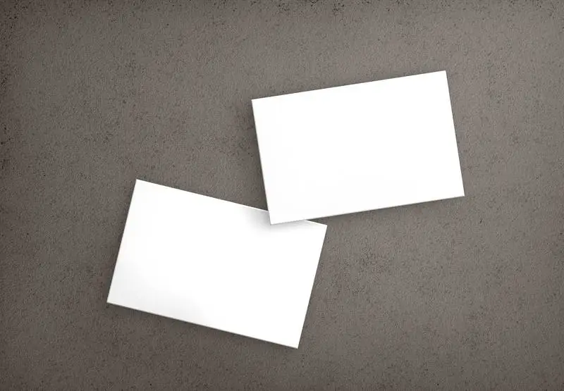 Set of Isolated Business Cards on Concrete Surface