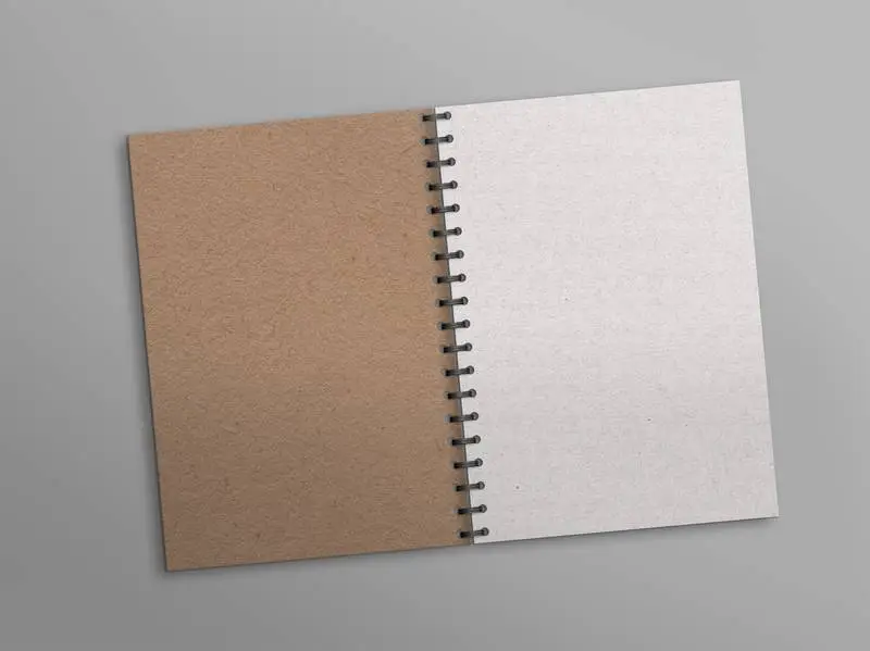 Open Notebook with White Paper