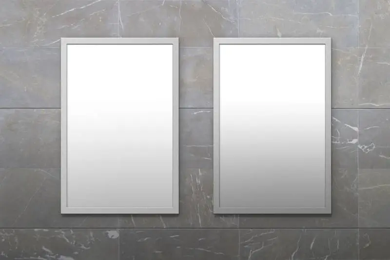 Two Posters Framed in Stone Wall