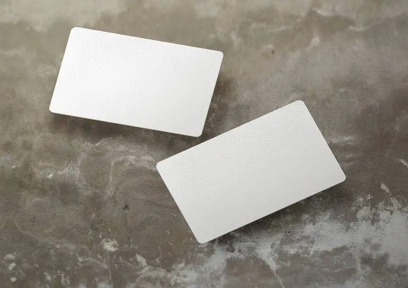 Floating Business Card Over Concrete Surface