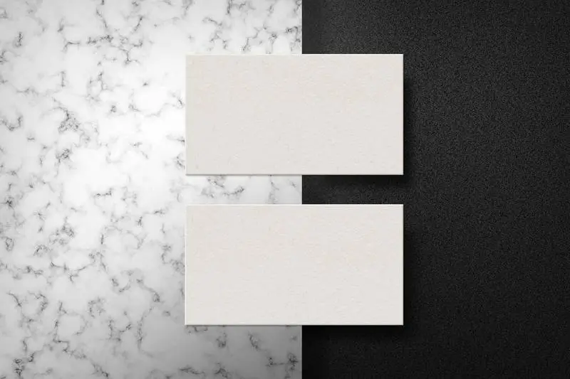 Couple of Business Cards on Marble Surface