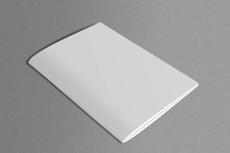 White Magazine on Marble Surface