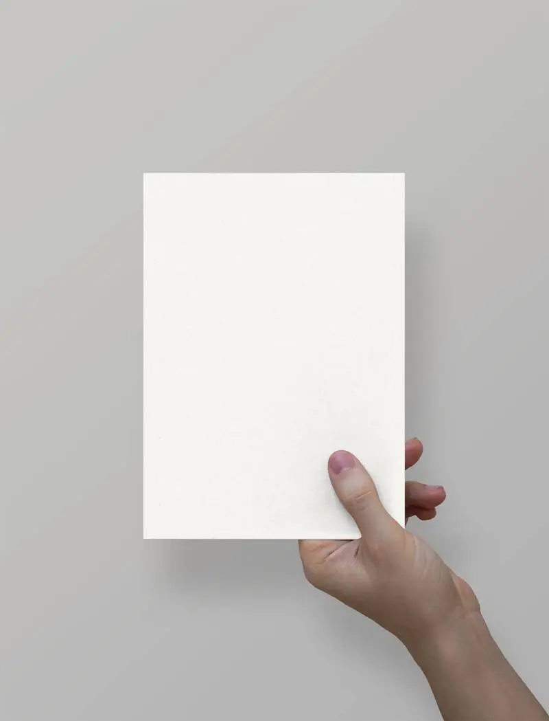Hand Holding A5 Paper Sheet