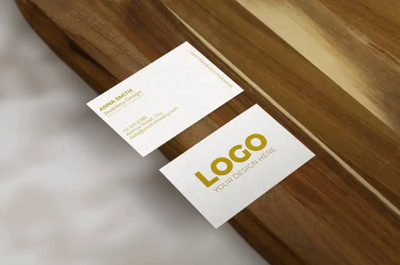 Business Card Over Wood Surface Mockup