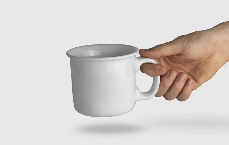Isolated Hand Holding a White Mug