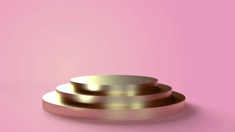 Three-Tiered Circular Golden Base on a Pink Background for Placing Objects