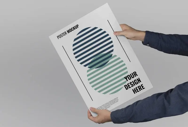 Mockup of Hands Holding a Large-Format Poster on a Flat Background