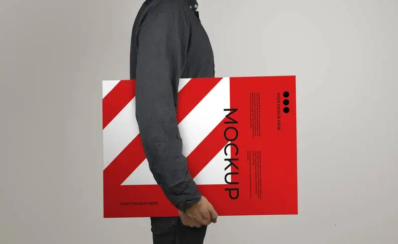 Mockup of a Model Holding a Poster in Horizontal Position