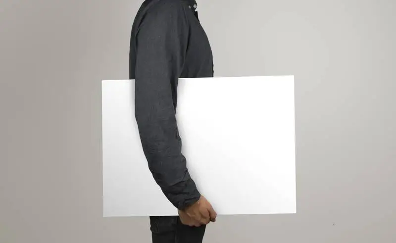 Isolated Model Holding a Poster in Horizontal Position