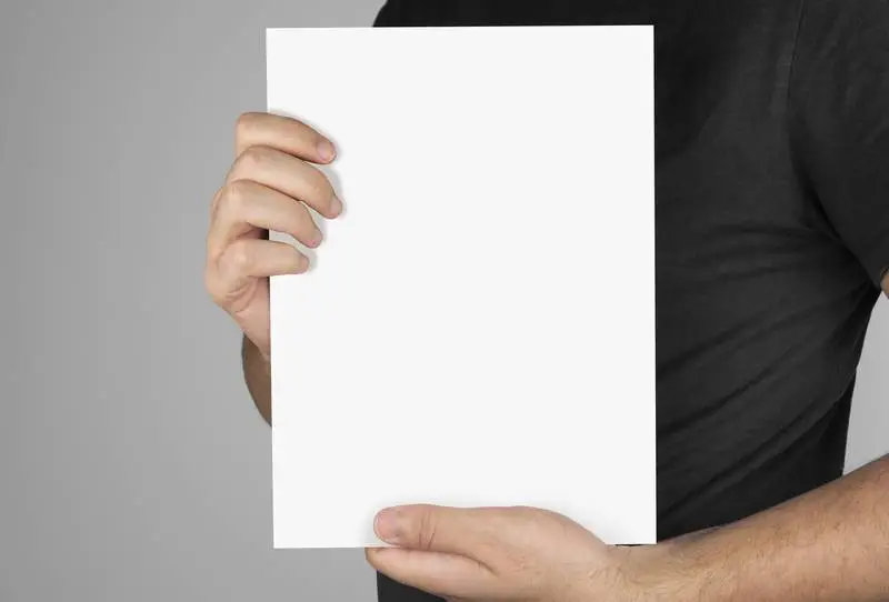 Image of a Model Holding a Blank Magazine Template