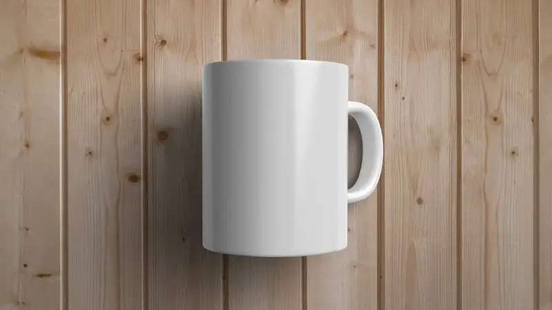 White Mug Over Wooden Surface