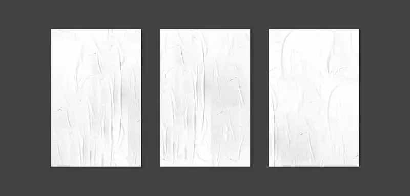 Collection of Crumpled Posters Over Black Surface