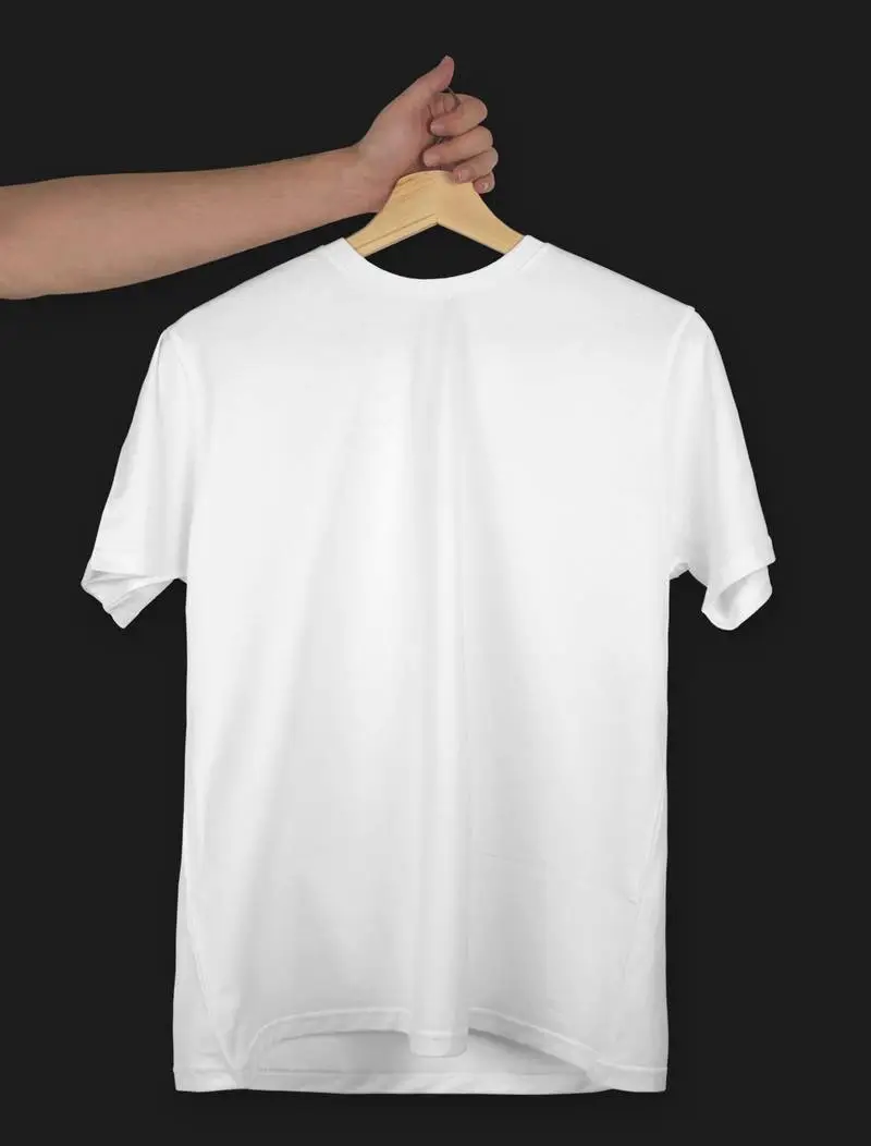 White T-Shirt on a Hanger Over Dark Surface
