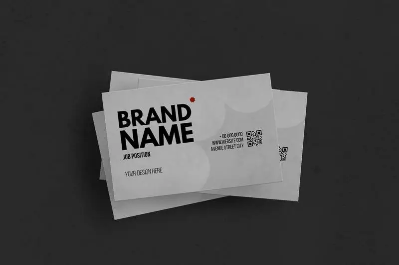 Set of White Business Cards Over Black Surface Mockup