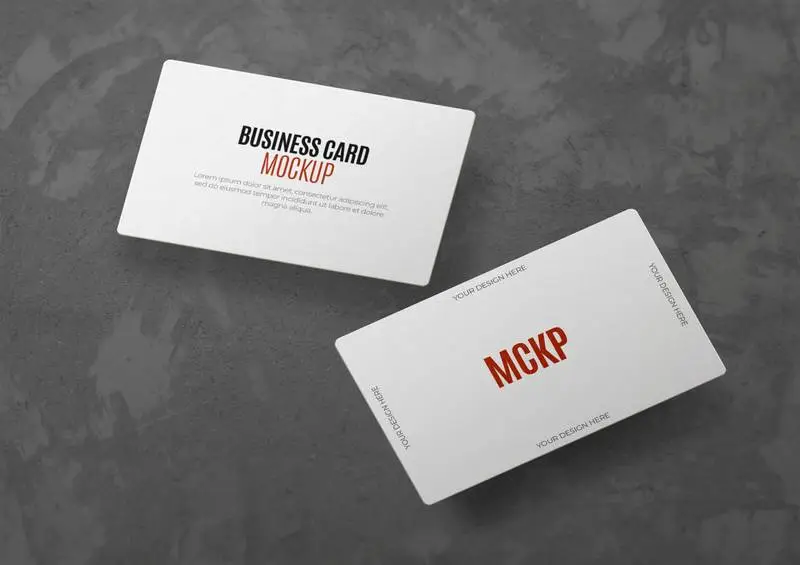 Mockup of Floating Business Cards Over Gray Concrete Surface