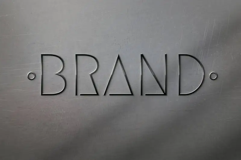 Mockup of 3D Metallic Logo on Scratched Metallic Surface