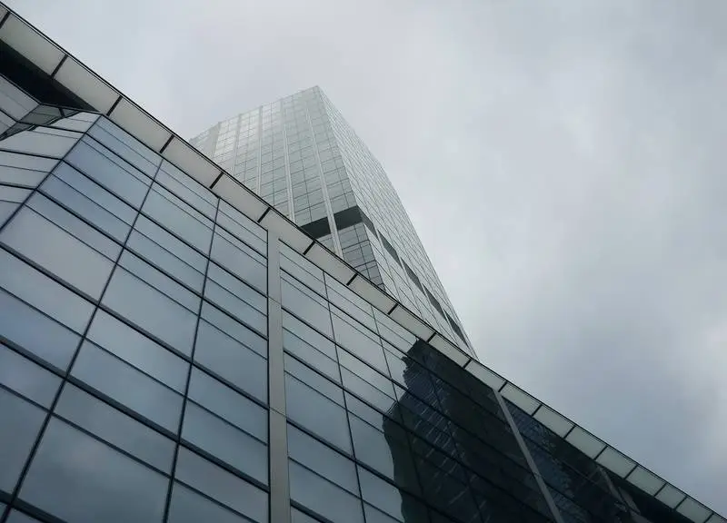 Minimalist Architectural Photo of Steel and Glass Building in Cloudy Weather