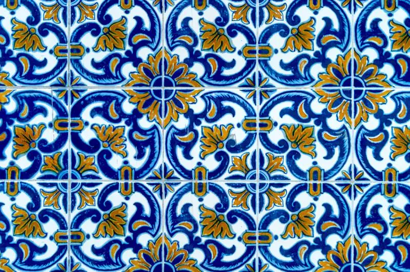 Background Photograph of Antique Portuguese Tile Pattern in Blue and Yellow Color