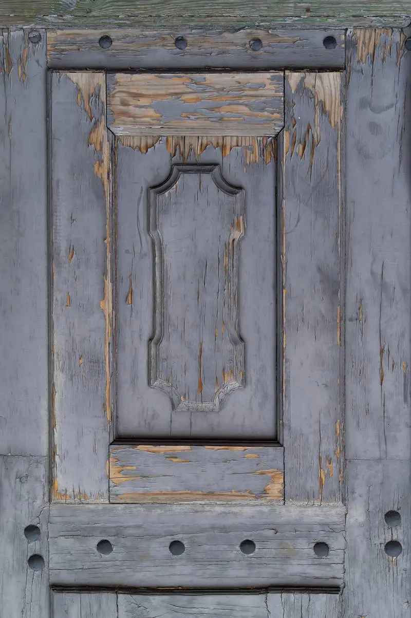Closeup Photo of Old Wooden Door with Peeling Gray Paint
