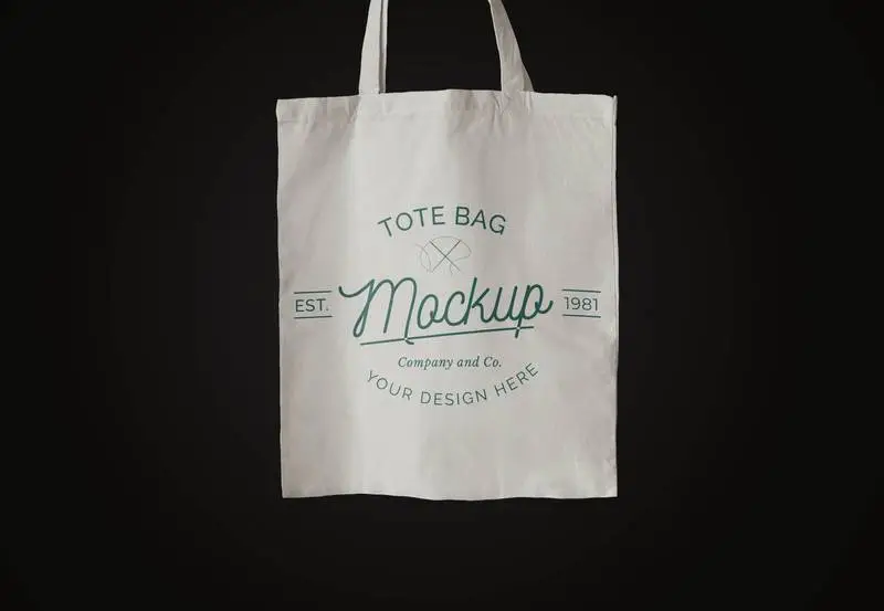 White Tote Bag Over Dark Surface Mockup