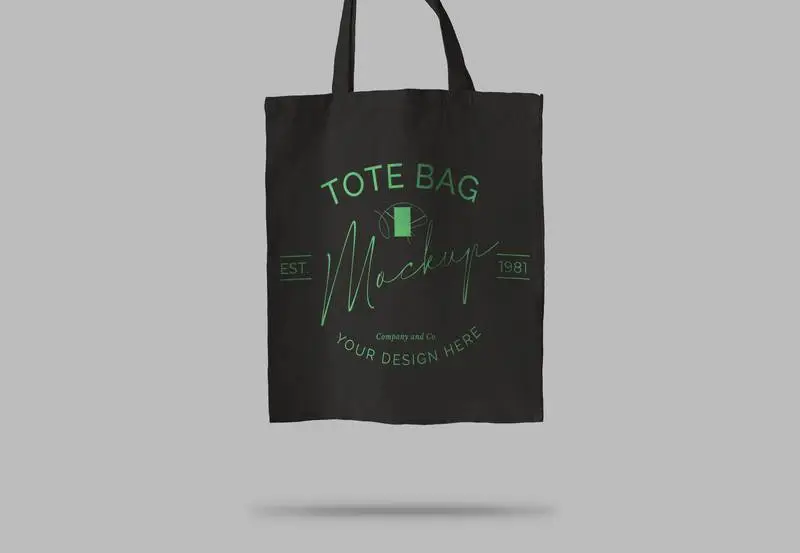 Black Tote Bag Over Light Surface Mockup