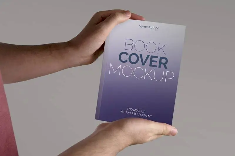 Mockup of Book Held on a Beige Background