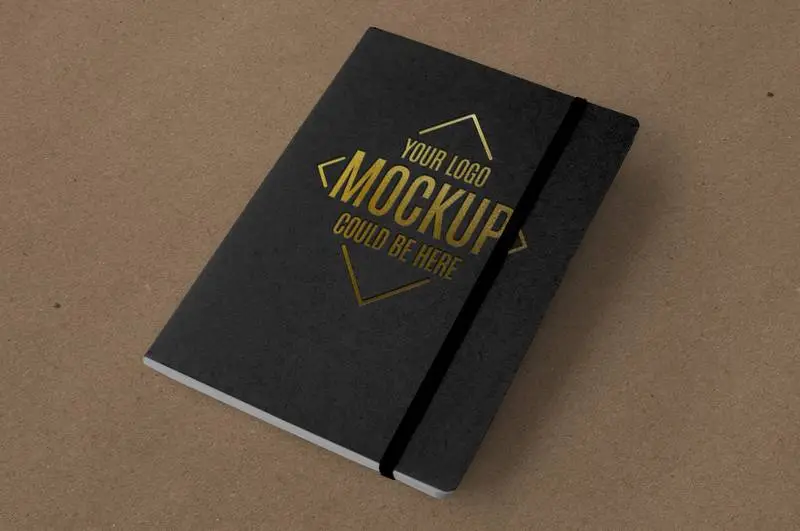 Gold Embossed Logo Mockup on Black Notebook