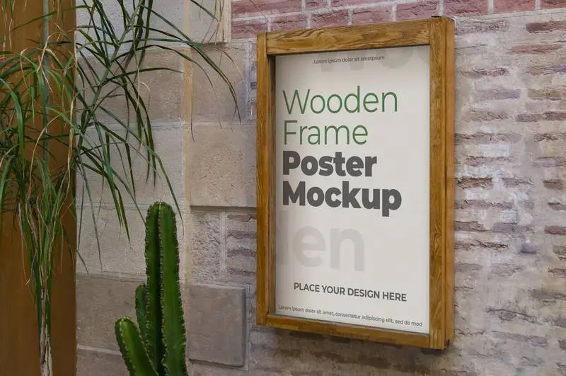 Mockup of a Poster in a Wooden Frame on a Stone Wall