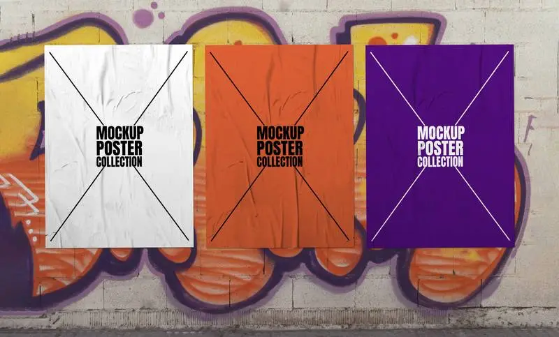 Collection of Three Crumpled Posters Over Graffiti Wall