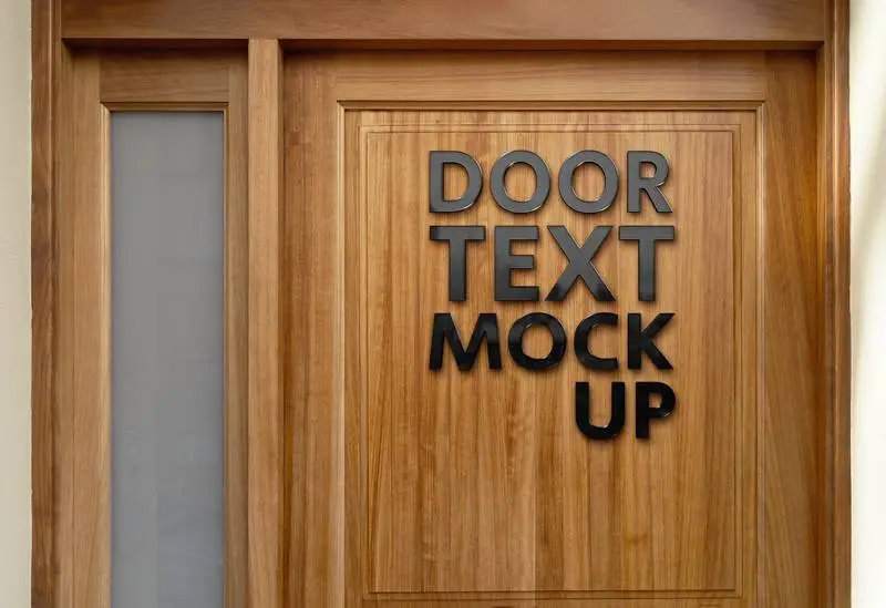 Mockup of Black Glossy Logo on Wooden Door