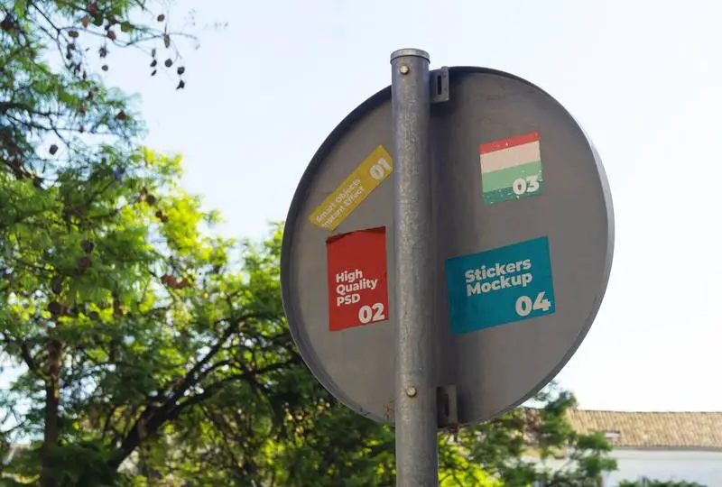 Mockup of Sticker Collection on the Back of a Traffic Sign