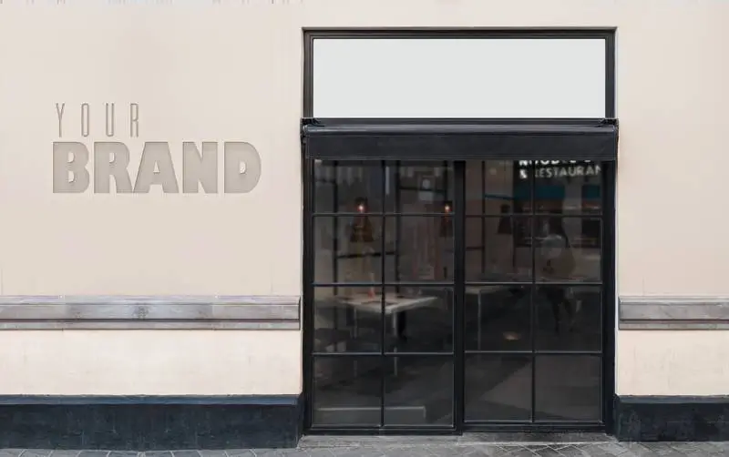 Mockup of Logo on Facade Next to Restaurant Door