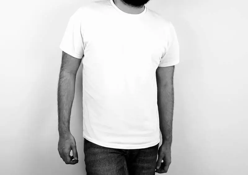 Black and White Photo of Man Wearing a White T-shirt on White Background