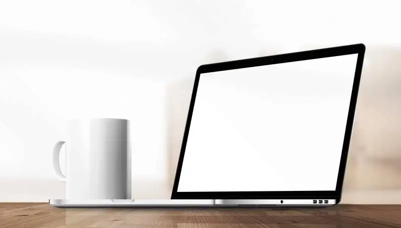 Mug and Laptop in Office Environment