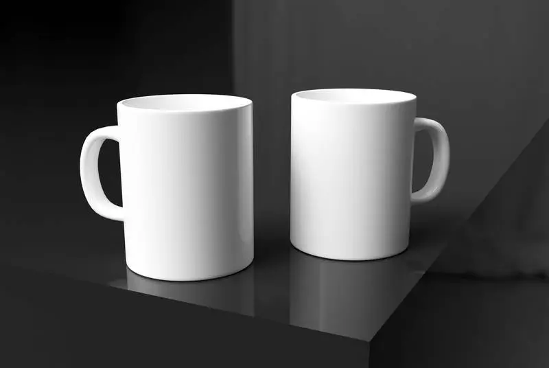 Two White Mugs on Elegant Dark Background