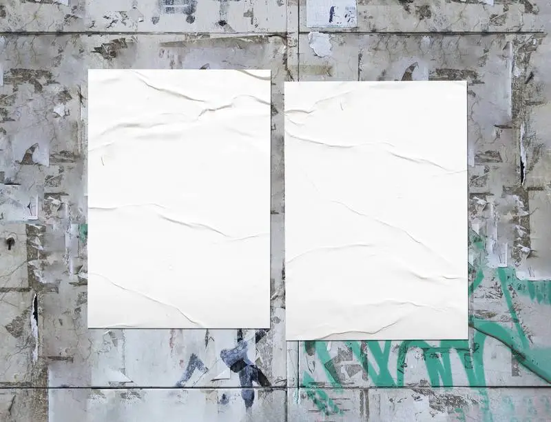 Two White Posters Glued on a Grunge Wall