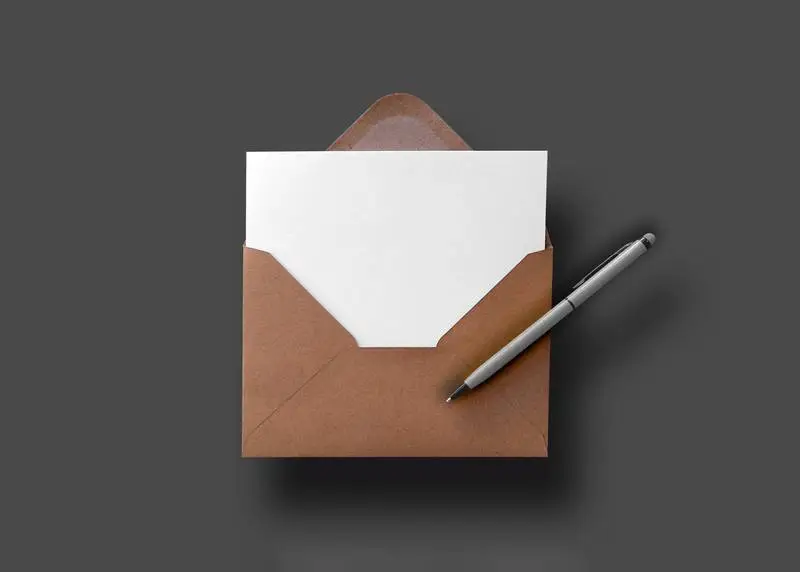 Floating Enveloped Card Over Wood Surface