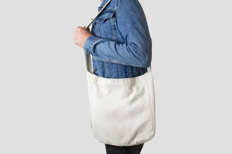 Male Model Holding White Tote Bag