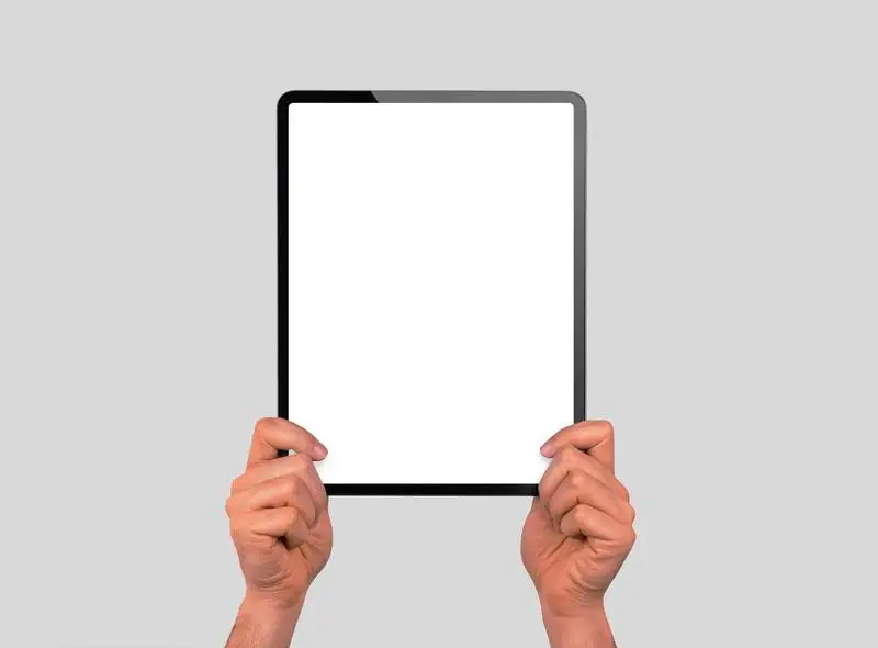 Photo of Hands Holding a Vertical Pro Tablet