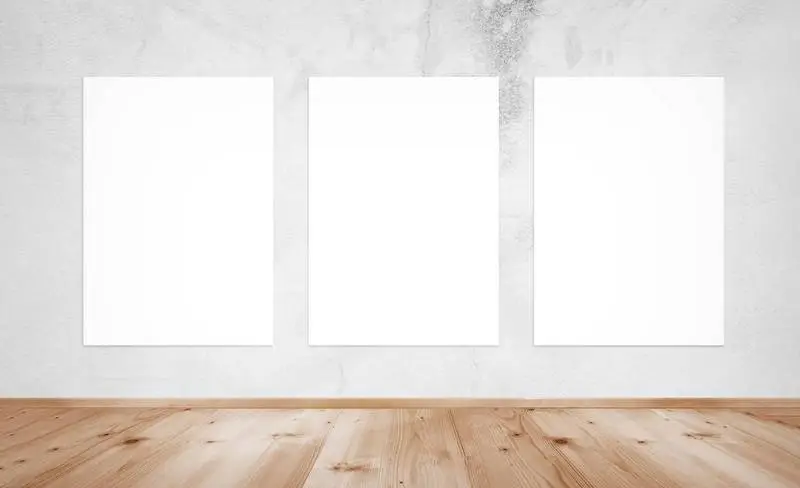 Three Plain White Posters on an Exhibition Wall