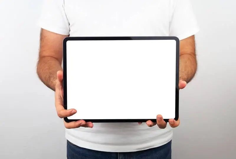 Man Holding a Horizontal Plain White Tablet Pro