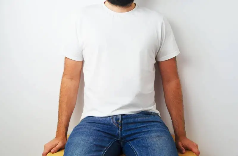 Seating Model with White T-shirt on Light Background