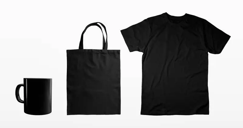 Set of Black T-shirt, Tote Bag and Mug on Light Background