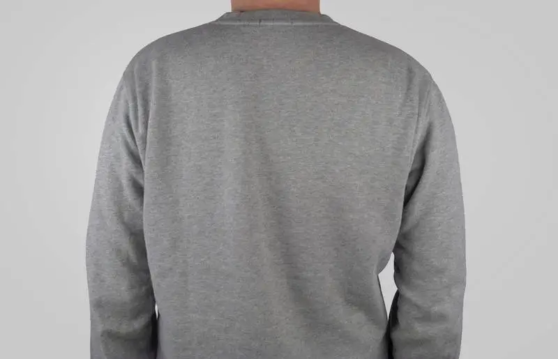 Back of a Gray Sweater on a Lilac Background