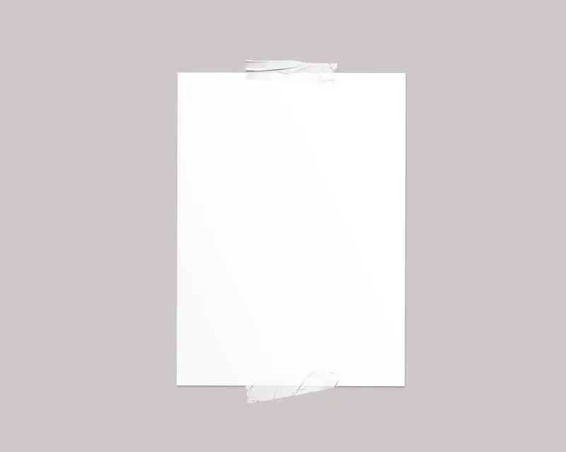 Plain White A4 Poster with Taped on a Light Wall