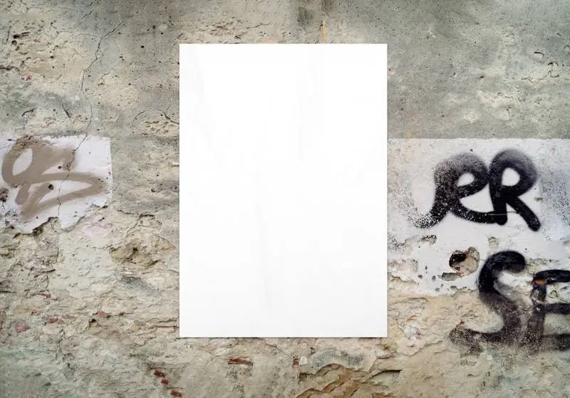 White Crumpled Poster on an Old Grunge Wall