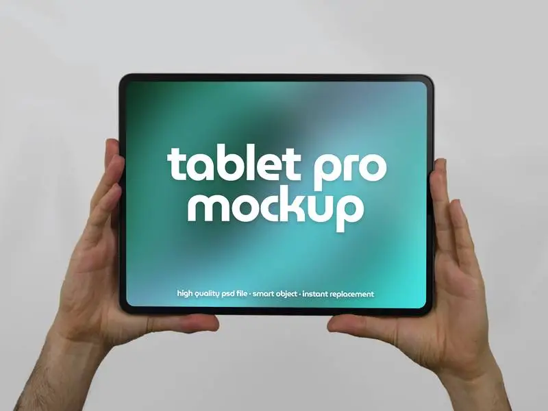 Mockup of Tablet Pro Horizontally Held by Two Hands on a Light Background