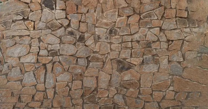 Background of Old Wall of Irregularly Shaped Stones